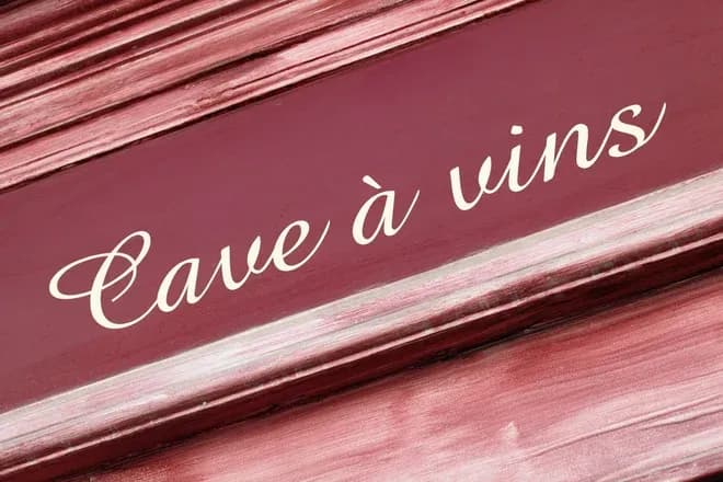 texte élégant sur fond rose avec inscription cave à vins